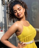 anupama-parameswaran-in-yellow-sleeveless-top-photos