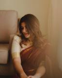 aparna-balamurali-in-coffee-brown-pattu-saree-with-chiku-colour-blouse-photos-004