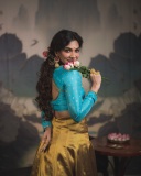 madonna-sebastian-in-blue-blouse-and-golden-skirt-photos-003