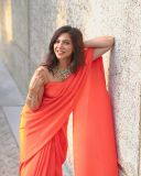 madonna-sebastian-in-orange-colour-saree-photos-004