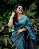 malavika-menon-in-peacock-color-saree-photos-003