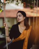 namitha-pramod-in-black-saree-with-orange-border-dress-photos-001