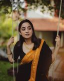 namitha-pramod-in-black-saree-with-orange-border-dress-photos-010