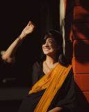 namitha-pramod-in-black-saree-with-orange-border-dress-photos-014