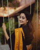 namitha-pramod-in-black-saree-with-orange-border-dress-photos