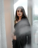 namitha-pramod-in-black-saree-with-sleeveless-heavy-work-blouse-photos-003