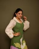 nikhila-vimal-in-flower-printed-olive-green-and-white-dress-photos-003