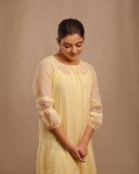 nikhila-vimal-in-light-lemon-yellow-colour-premium-kurti-dress-photos-001