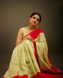 nikhila-vimal-in-olive-green-in-red-border-saree-images-001