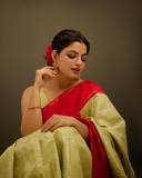 nikhila-vimal-in-olive-green-in-red-border-saree-images-005