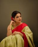 nikhila-vimal-in-olive-green-in-red-border-saree-images-006