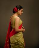 nikhila-vimal-in-olive-green-in-red-border-saree-images