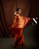 nikhila-vimal-in-orange-orange-pattu-saree-with-maroon-red-blouse-photos-002