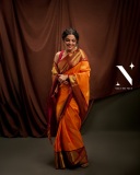 nikhila-vimal-in-orange-orange-pattu-saree-with-maroon-red-blouse-photos-003