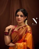 nikhila-vimal-in-orange-orange-pattu-saree-with-maroon-red-blouse-photos-004