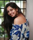 niranjana-anoop-in-off-shoulder-floral-print-short-dress-photos