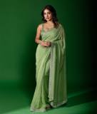 saniya-iyappan-in-green-chiffon-saree-with-sleeveless-blouse-design-photos