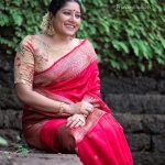 anumol new photos in red pattu saree