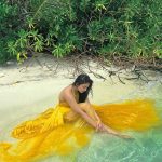 ahaana krishna yellow sleeveless gown photoshoot at maldives 001