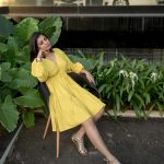 leona lishoy in yellow outfit