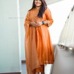 aparna balamurali in orange dress