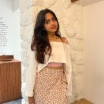 devika sanjay in cropped blouse and floral pattern shorts