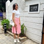 devika sanjay in pink skirt and top