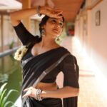 actress aditi ravi new photos in black colour dhavani with silver border 2