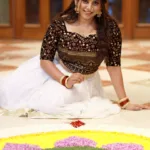 anna reshma rajan in black top and white skirt