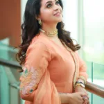 bhavana latest photos in coustom made peach colour churidar from Mannath Luxe 012