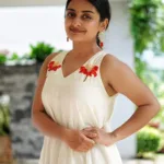 esther anil in off white pure mul cotton Vaaka flower embroidered A line flared onam dress