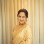 miya george in golden clour saree photos 002